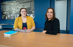 Katie Dilks sits with Stephanie Ewing